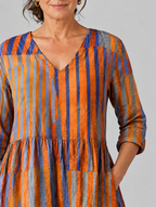 Ardith long blouse in burnt orange and violet painted stripe print, close up of print and neckline