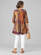 Ardith long blouse in burnt orange and violet painted stripe print, back view