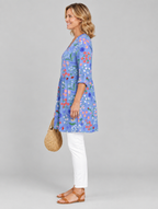 Cendrine long blouse in periwinkle garden print, side view showing the relaxed fit
