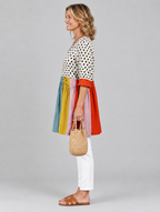 Dottie long blouse in polka dot colour block, side view showing the relaxed fit
