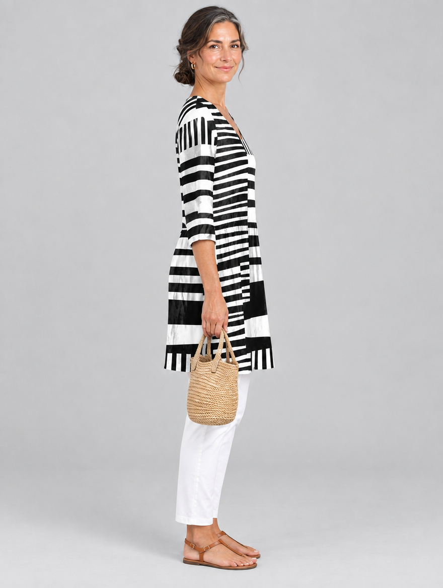 Vivica long blouse in black and white block stripe print, side view showing the relaxed fit