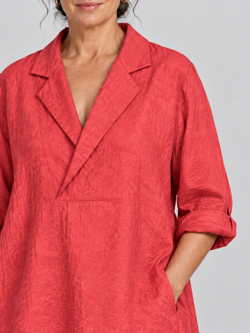Rubina relaxed tunic in coral red, close up of lapel collar and neckline