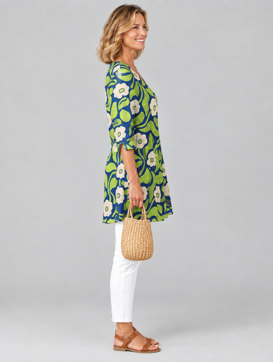 Joni long blouse in navy and lime retro daisy print, side view showing the relaxed fit