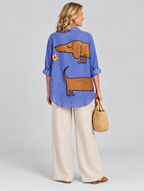 Brynja relaxed tunic in periwinkle blue sausage dog print, back view