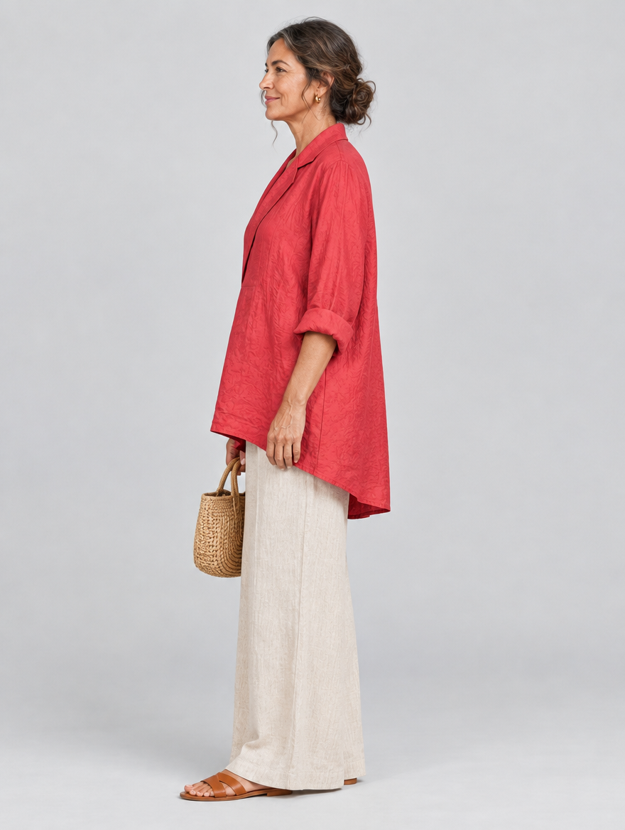 Rubina relaxed tunic in coral red, side view showing the relaxed fit