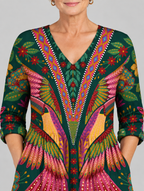 Alcina long blouse in forest green phoenix feather print, close up of print and neckline