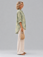 Sigrid relaxed tunic in sage green tonal peony print, side view showing the relaxed fit