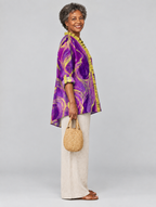 Regina relaxed tunic in violet and gold marble print, side view showing the relaxed fit