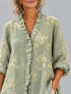 Sigrid relaxed tunic in sage green tonal peony print, close up of print and ruffle collar