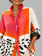 Melba relaxed tunic close up of print and ruffle neckline