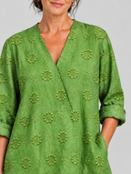 Pomona relaxed tunic in apple green, close up of textured flower pattern and neckline