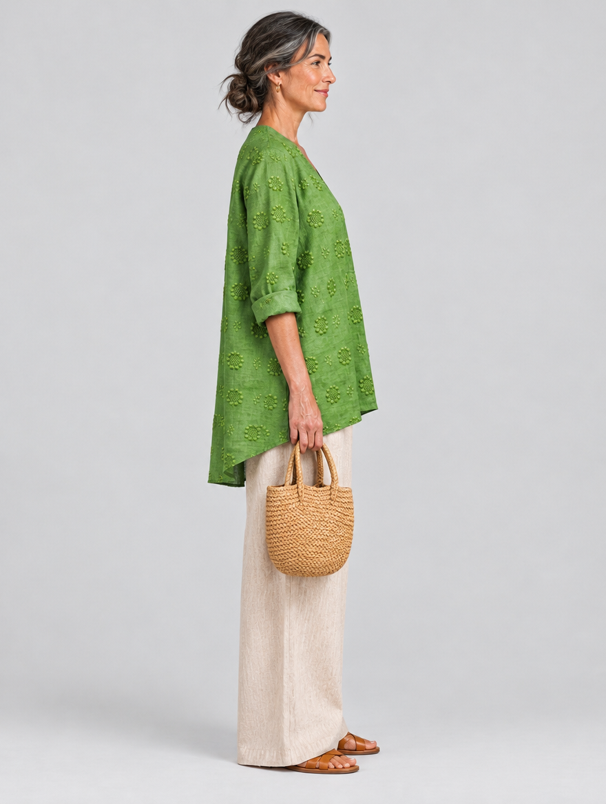 Pomona relaxed tunic in apple green, side view showing the relaxed fit