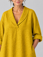 Topaz relaxed tunic in mustard yellow, close up of shawl collar and textured weave