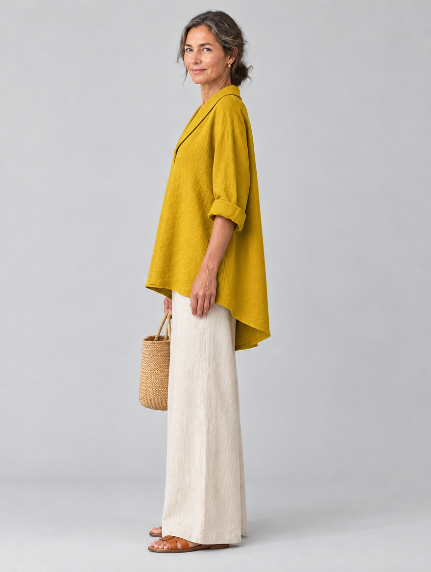 Topaz relaxed tunic in mustard yellow, side view showing the relaxed fit
