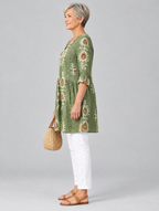 Sylvana long blouse in sage green botanical print, side view showing the relaxed fit
