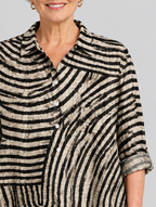 Desma relaxed tunic in sand and black swirl print, close up of print and collar