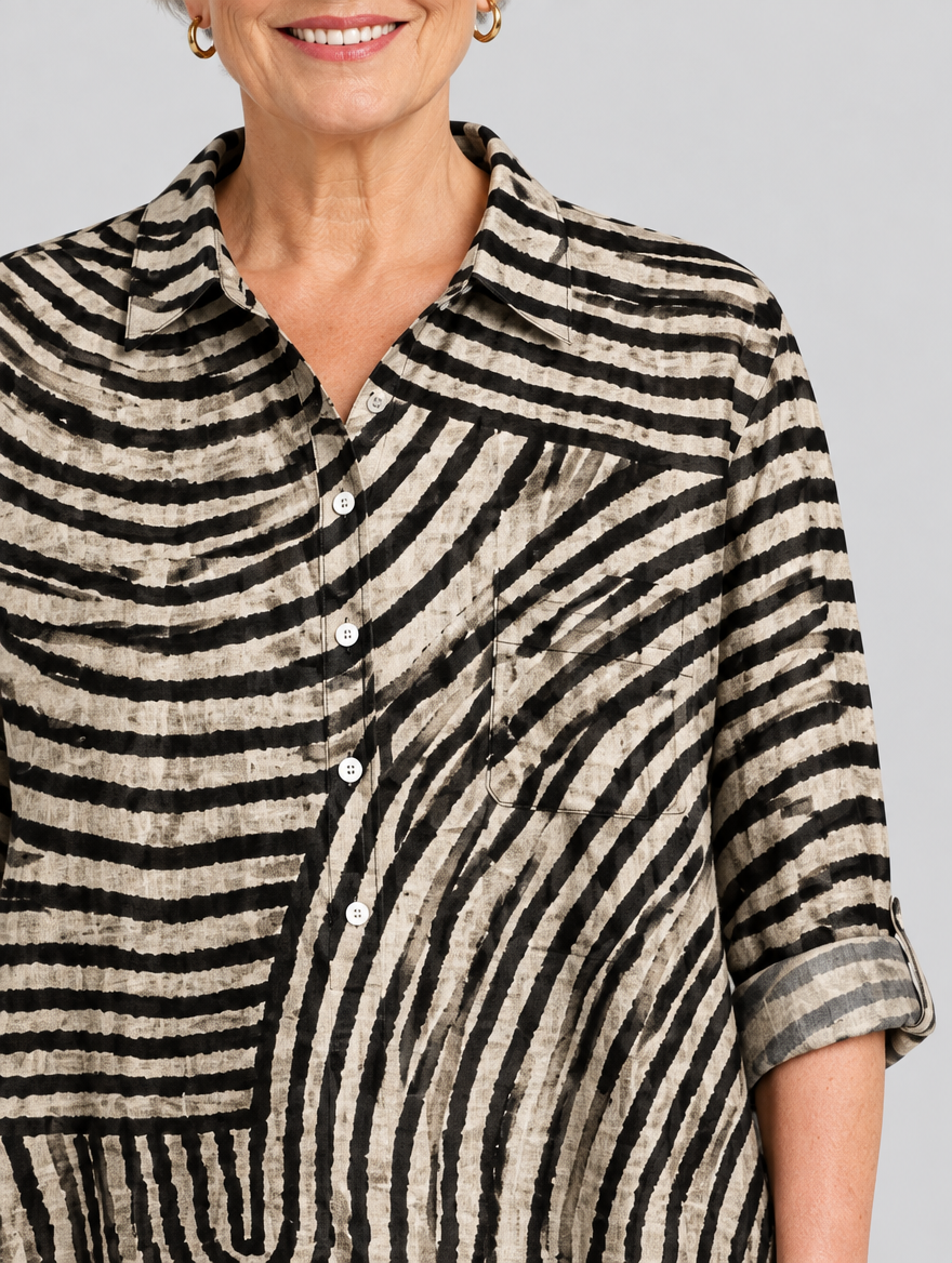 Desma relaxed tunic in sand and black swirl print, close up of print and collar