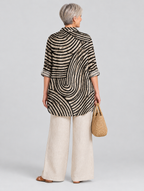 Desma relaxed tunic in sand and black swirl print, back view