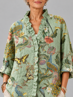 Pamina relaxed tunic in sage peacock and poppy print, close up of print and ruffle collar