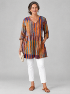 Ardith long blouse in burnt orange and violet painted stripe print, front view