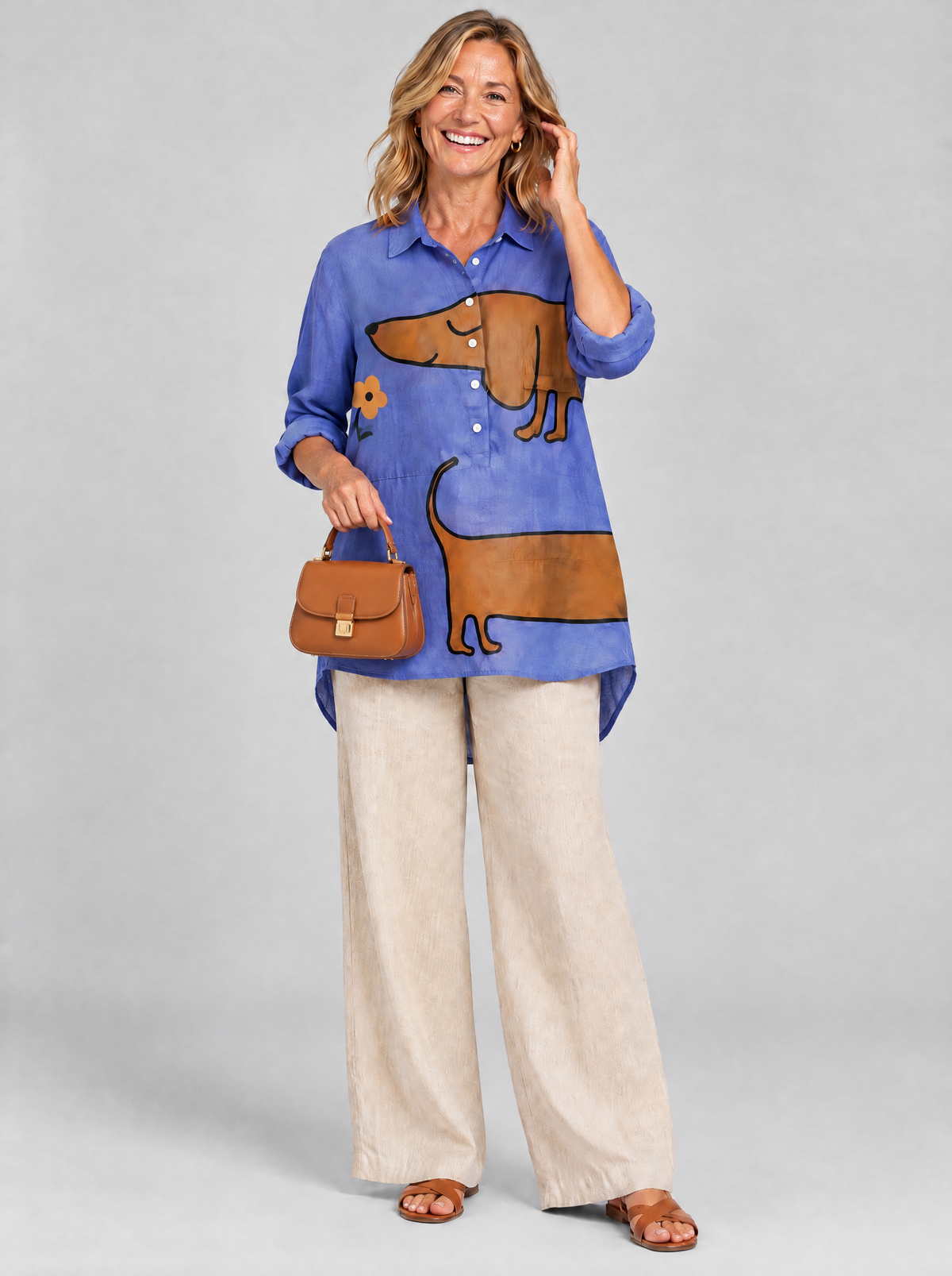 Brynja relaxed tunic in periwinkle blue sausage dog print, front view
