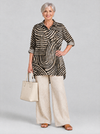 Desma relaxed tunic in sand and black swirl print, front view