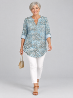 Isaura printed tunic top in light blue with embossed rose print, front view