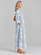 Rosaline printed maxi dress in blue with raised white floral print, side view