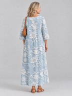 Rosaline printed maxi dress in blue with raised white floral print, back view