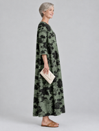 Kassia printed maxi dress in sage green with black floral print, side view