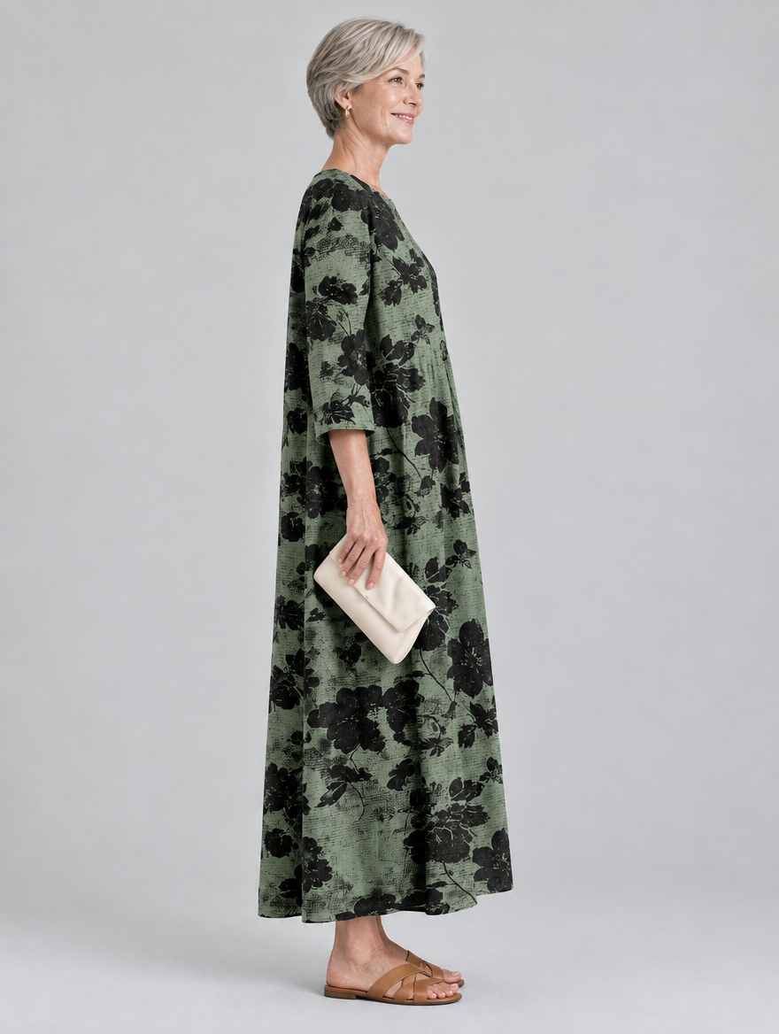 Kassia printed maxi dress in sage green with black floral print, side view