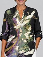 Orla printed shirt in black with crane and blossom print, close up of print and neckline