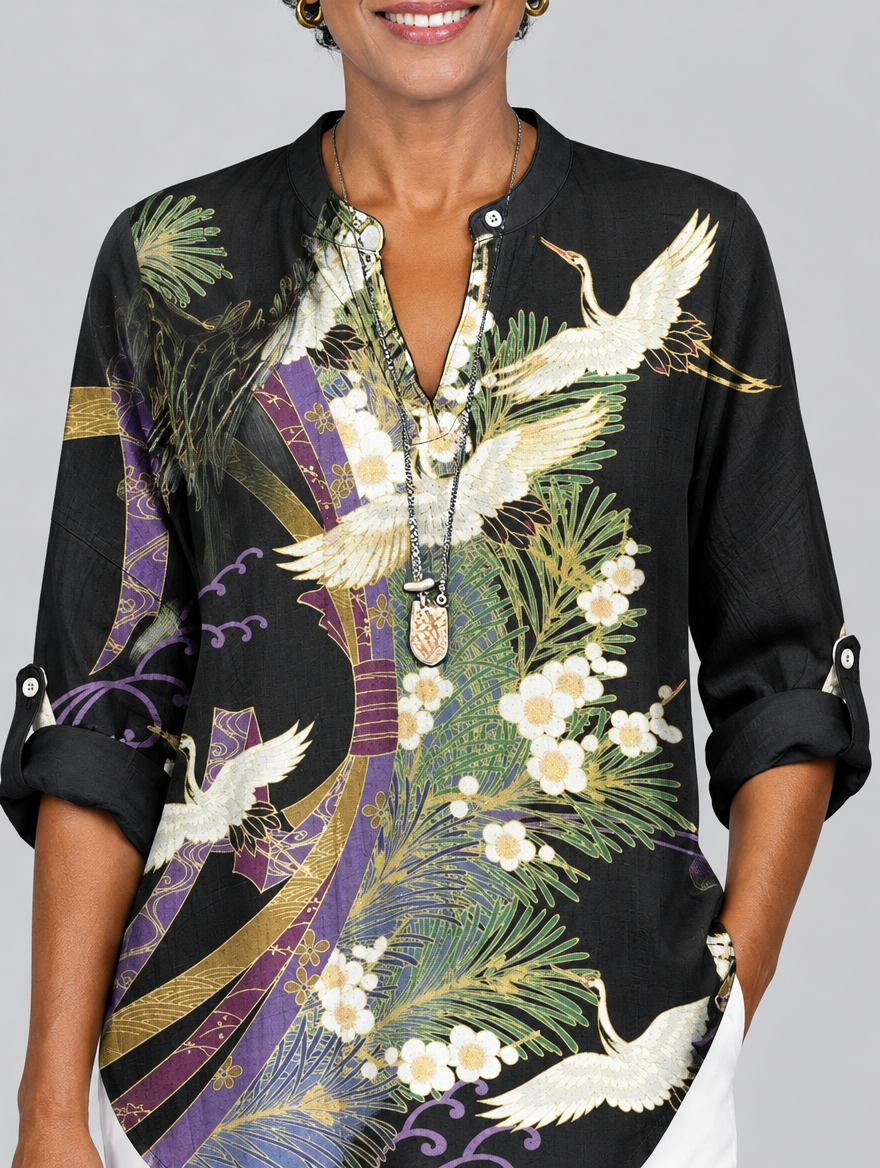 Orla printed shirt in black with crane and blossom print, close up of print and neckline