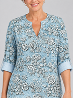 Isaura printed tunic top in light blue with embossed rose print, close up of print and neckline