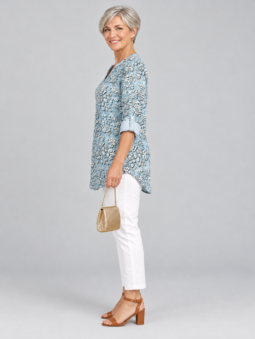 Isaura printed tunic top in light blue with embossed rose print, side view