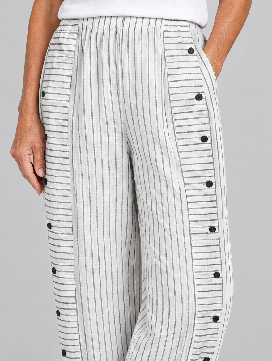 Nanette button trousers in white stripe, close up of waistband, side buttons and fabric