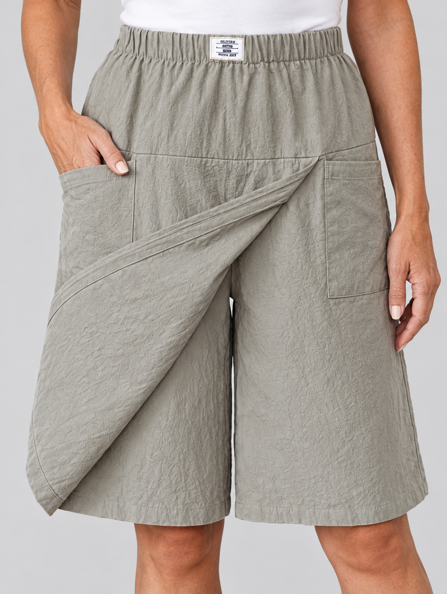Lorella skort shorts in light grey, close up of waistband, wrap panel and pockets