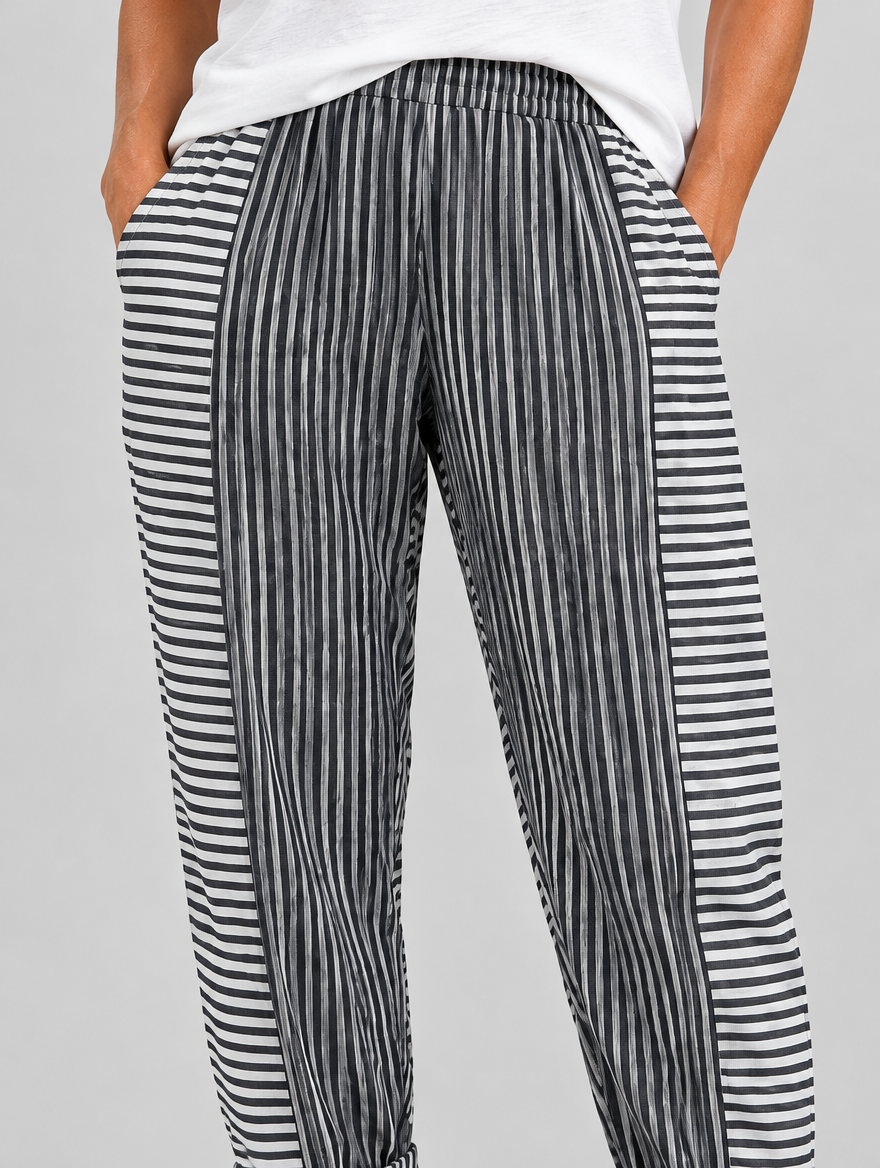 Saffy relaxed fit trousers in black stripe, close up of waistband, side panels and fabric