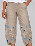 Petunia floral comfort pants in khaki, close up of flower print and tulip hem