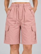 Tirza cargo shorts in dusty pink, close up of drawstring waistband and cargo pockets