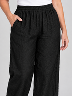 Quinta linen pants, black pair from the pack of 5, close up of waistband and fabric