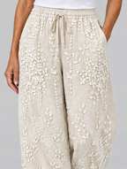 Hyacinth vine printed trousers in beige, close up of waistband and fabric