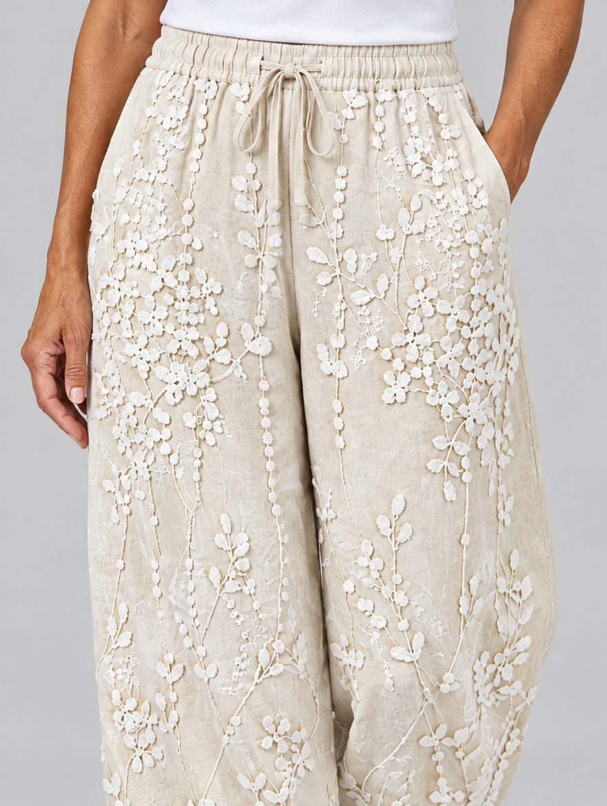 Hyacinth vine printed trousers in beige, close up of waistband and fabric