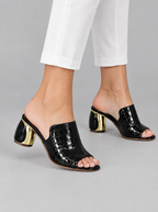 Valeska sandals in black, worn with white cropped trousers