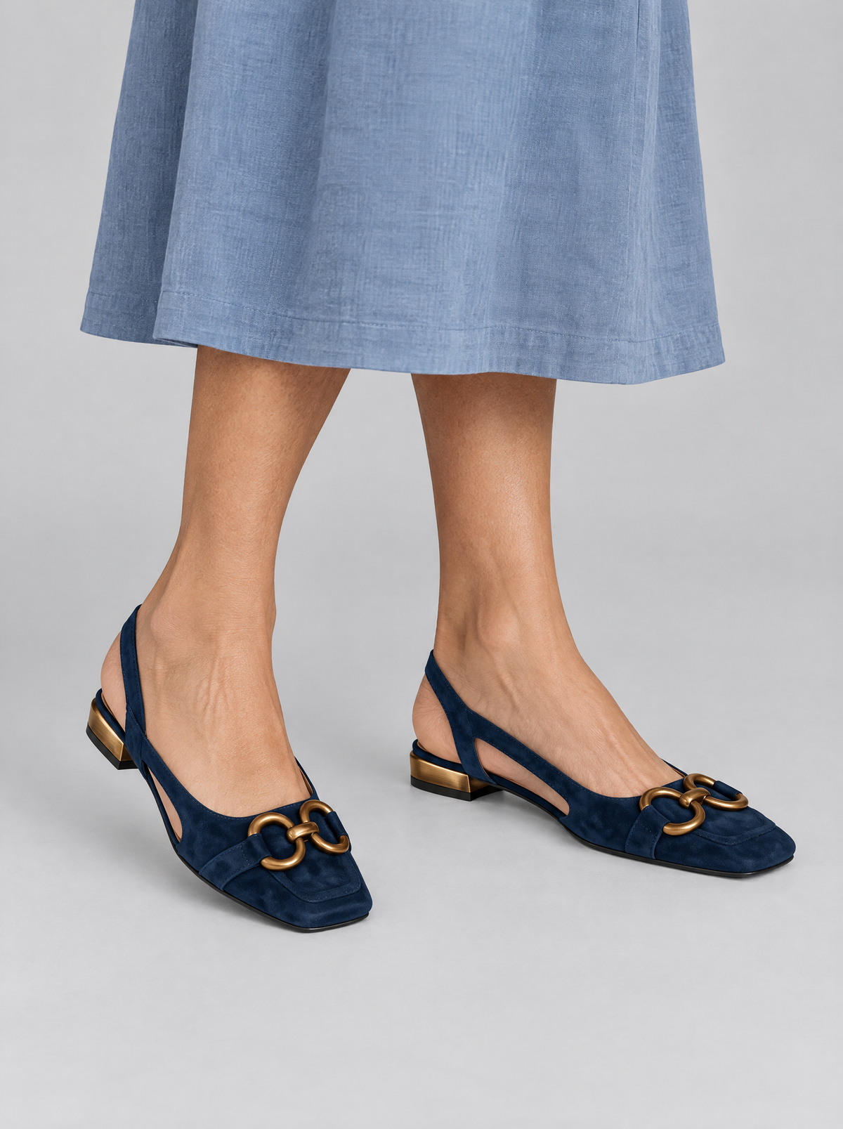 Viveca sandals in navy blue, worn with a dusty blue linen skirt