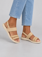 Freya sandals in beige, worn with light blue jeans
