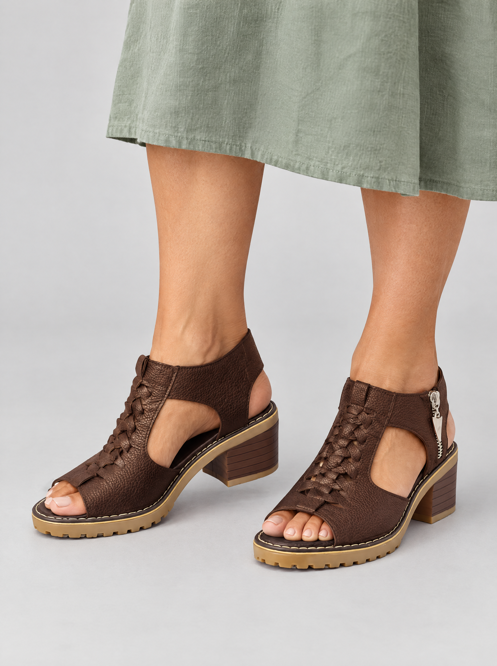 Ouida sandals in brown, worn with a sage green linen dress