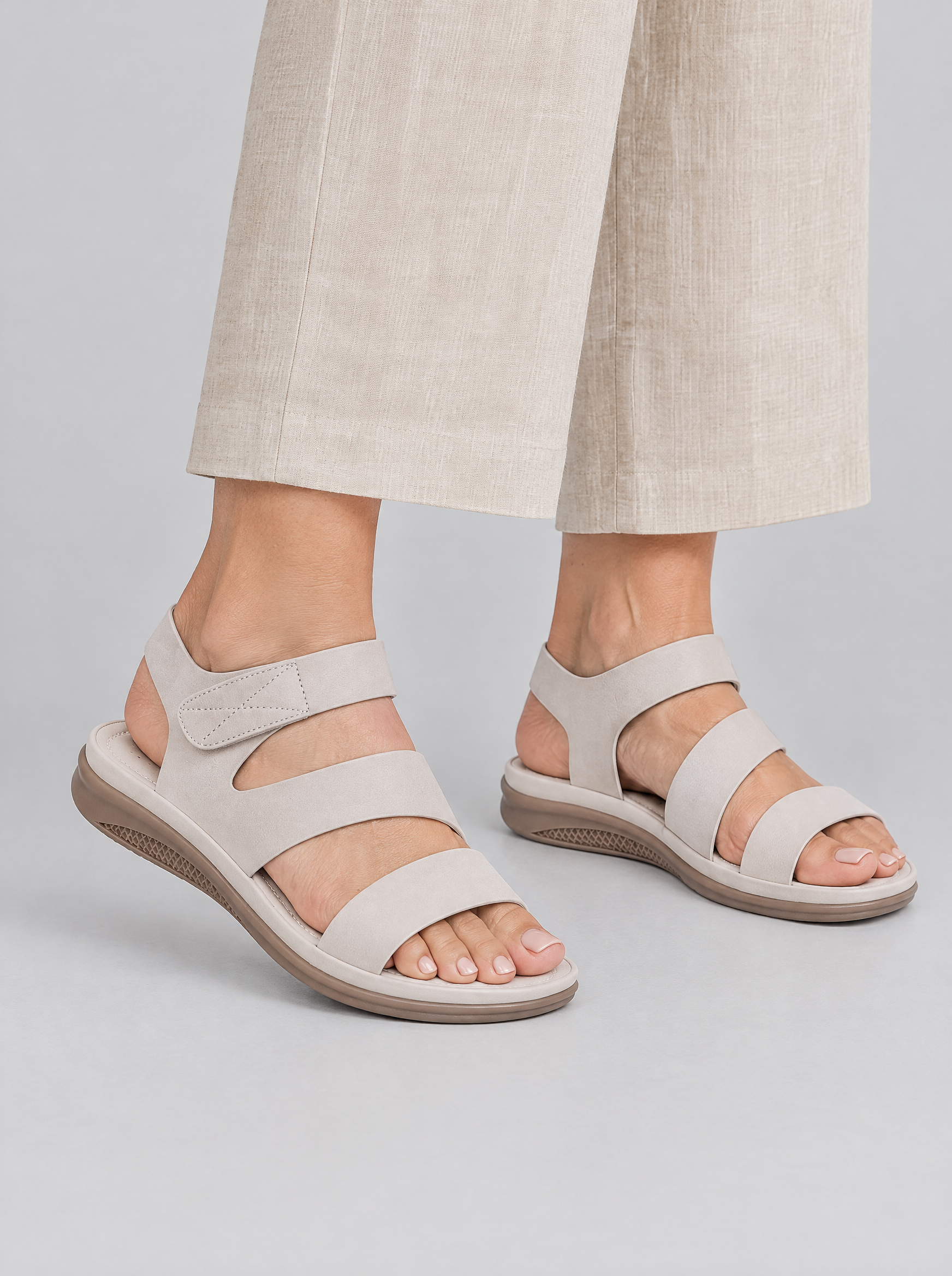 Dagny sandals in beige, worn with neat beige linen wide leg trousers