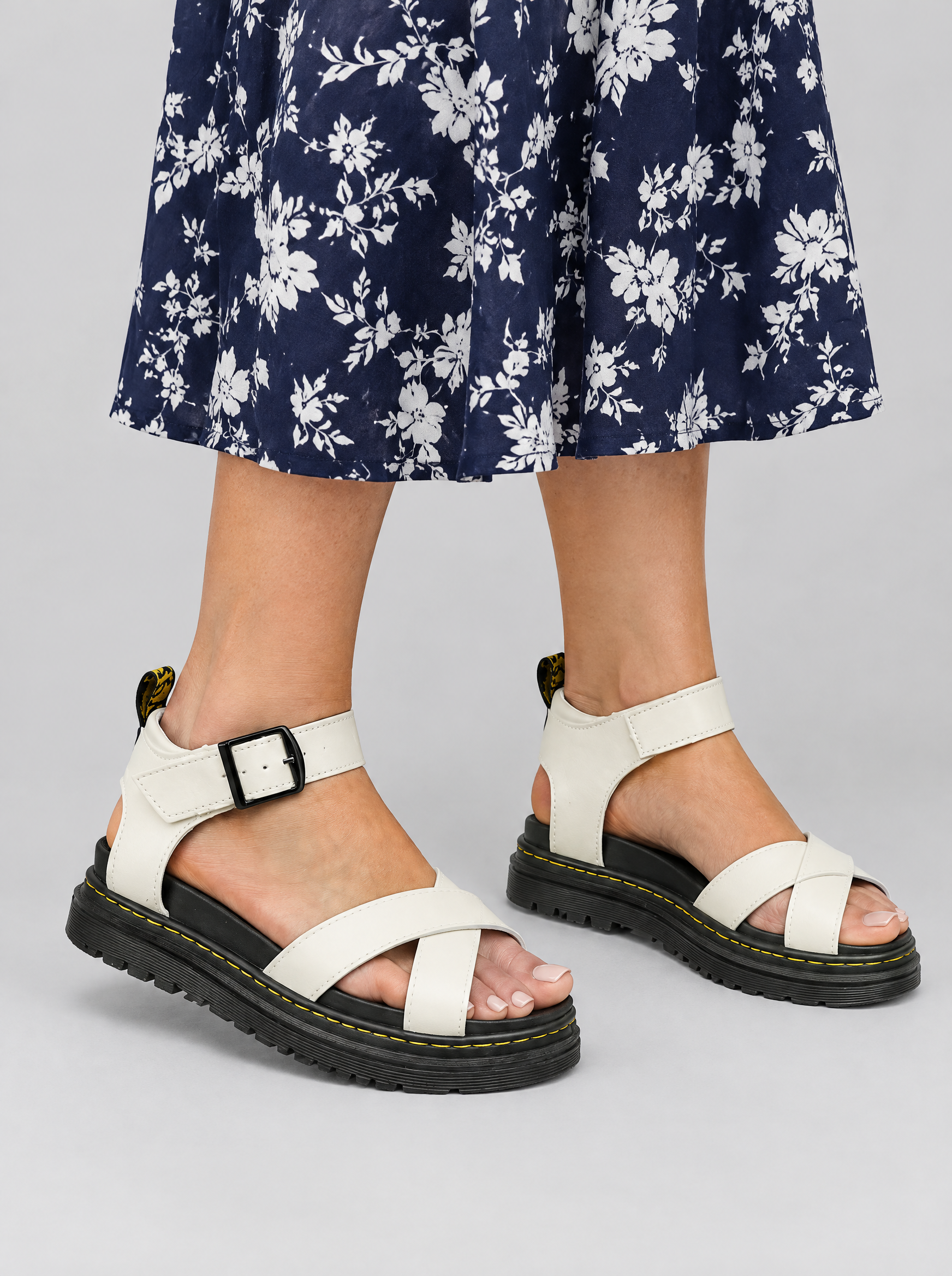 Fern sandals in white, worn with a navy and white floral dress