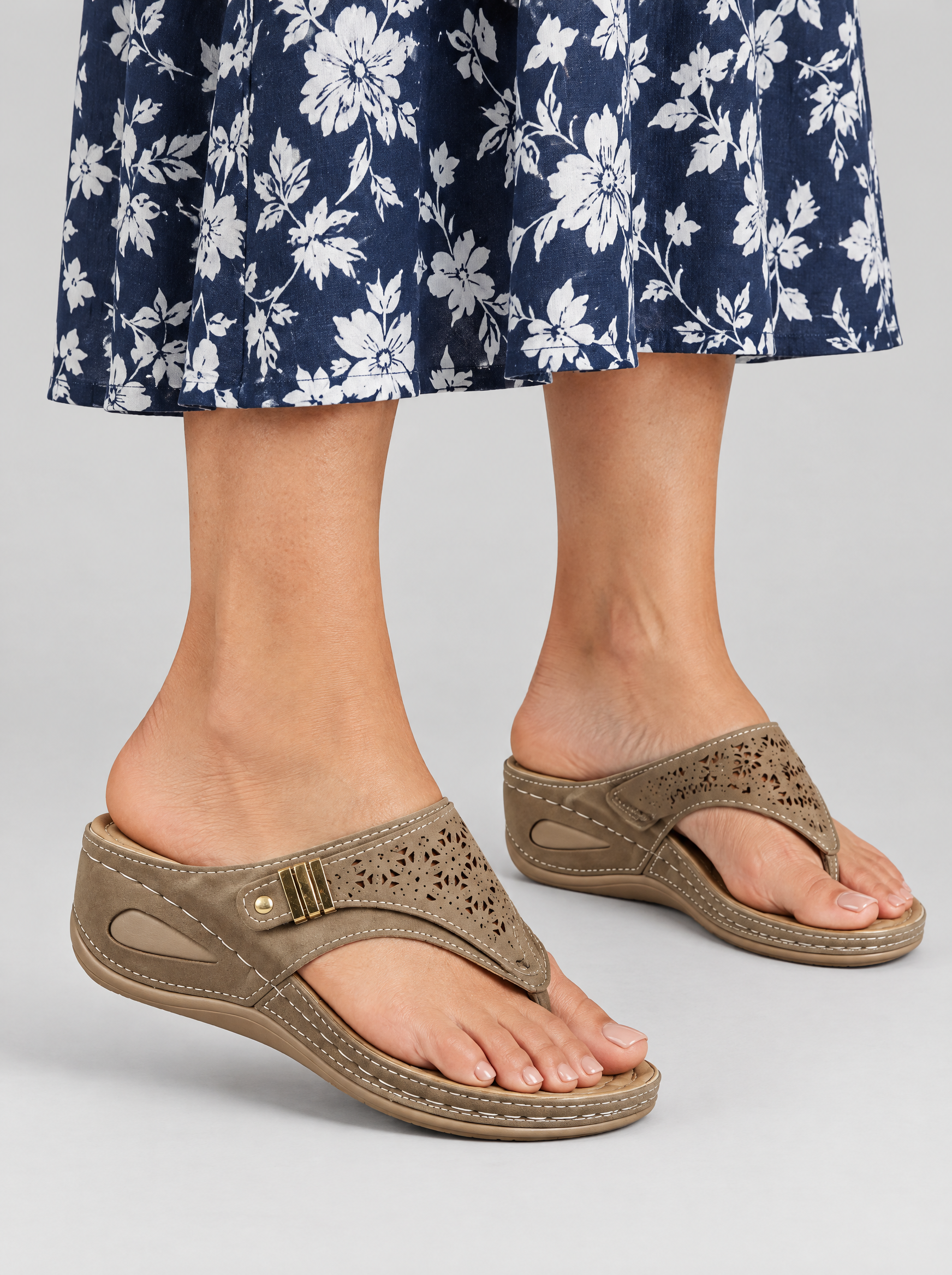 Verna sandals in brown, worn with a navy and white floral print midi dress